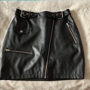 Faux leather skirt with buckle accents & front zip